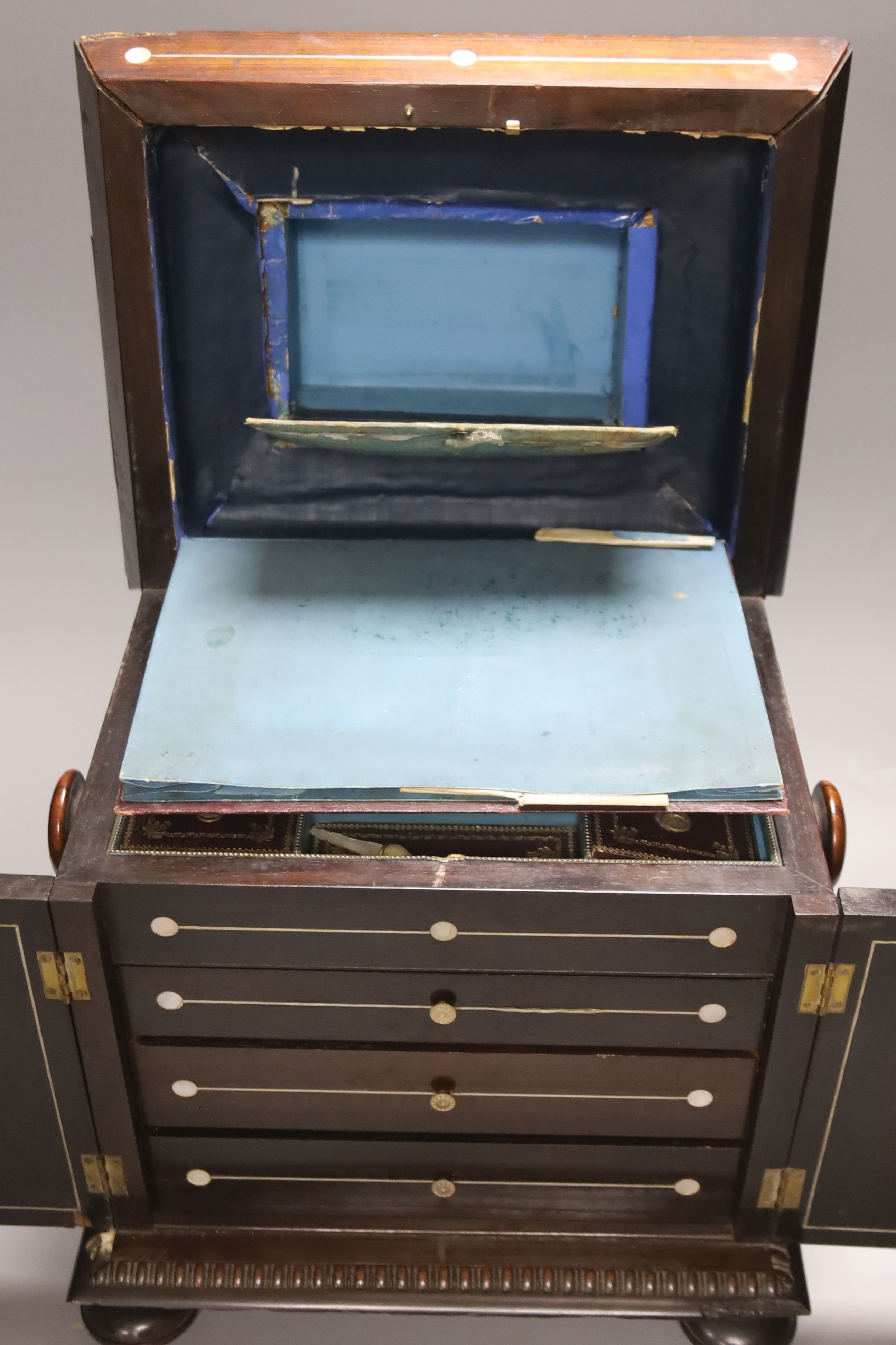 A William IV mother of pearl inset rosewood work box, height 36cm, containing mother-of-pearl and ivory items